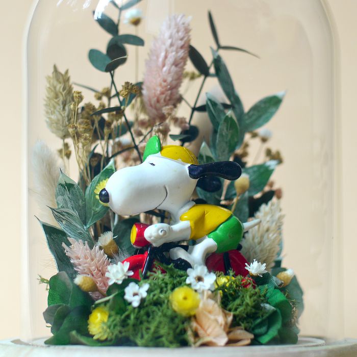 Cloche fleurie Snoopy cycliste