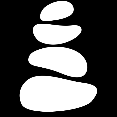 Une pile de pierres blanches sur fond noir.