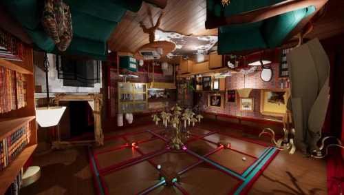 Intérieur d'une salle décorée avec des meubles en bois, un tapis au centre avec des rails colorés et une grande lampe suspendue, des canapés verts et une bibliothèque remplie de livres.