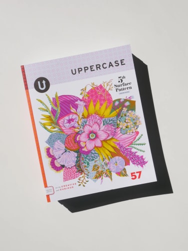 Couverture du magazine Uppercase numéro 57, illustrée d'un bouquet floral coloré et richement détaillé dans des tons rose, jaune et violet, sur fond blanc.