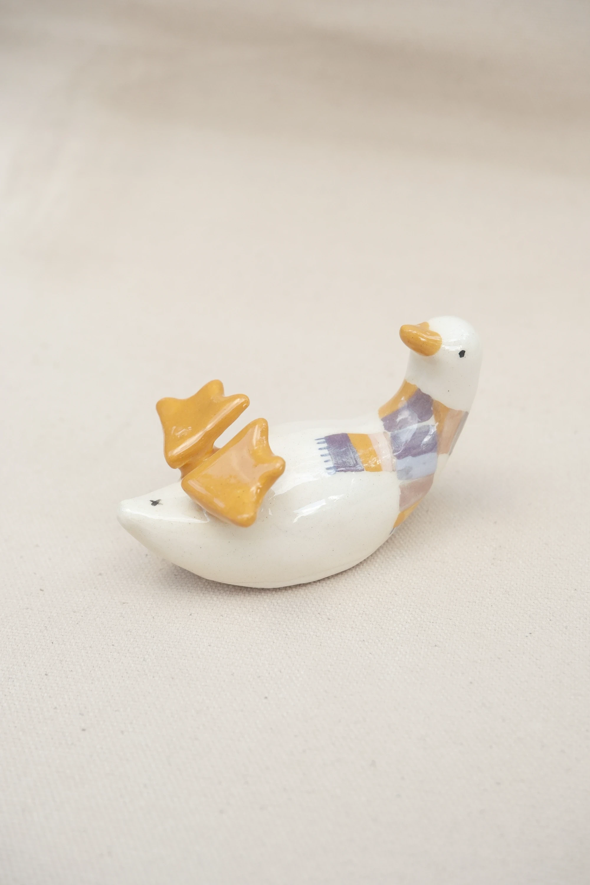 Canard sur le dos écharpe