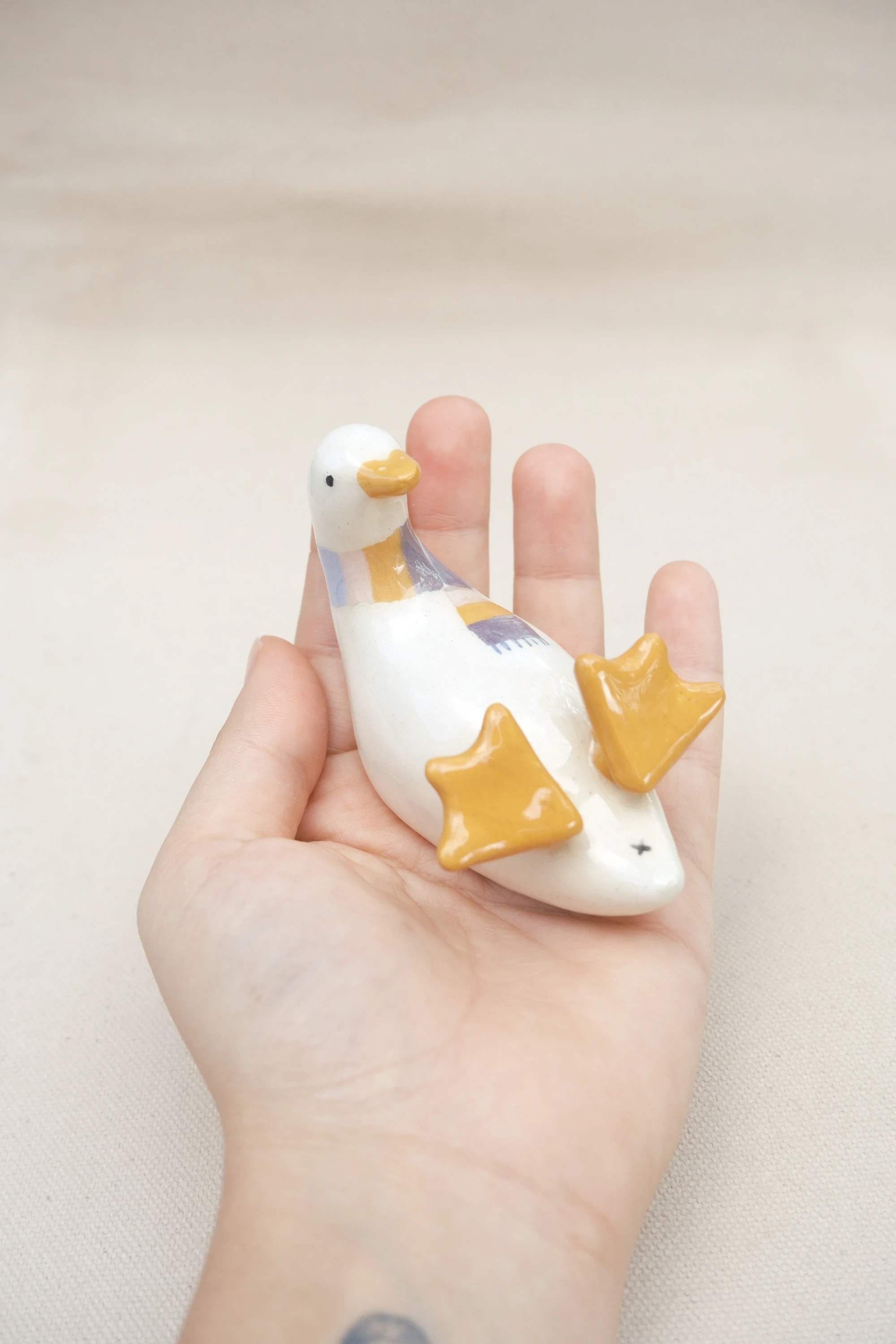 Canard sur le dos écharpe