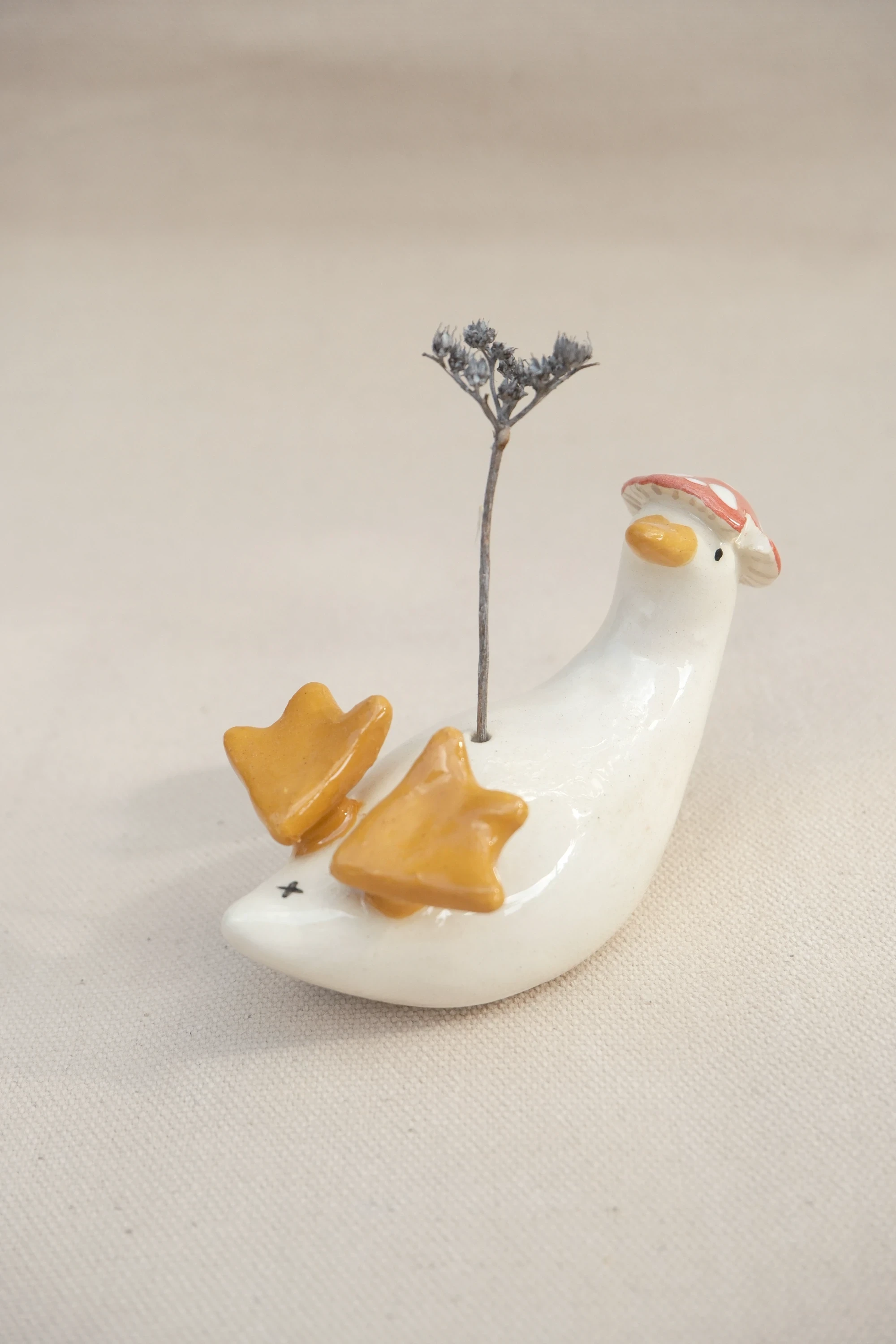 Soliflore canard amanite sur le dos