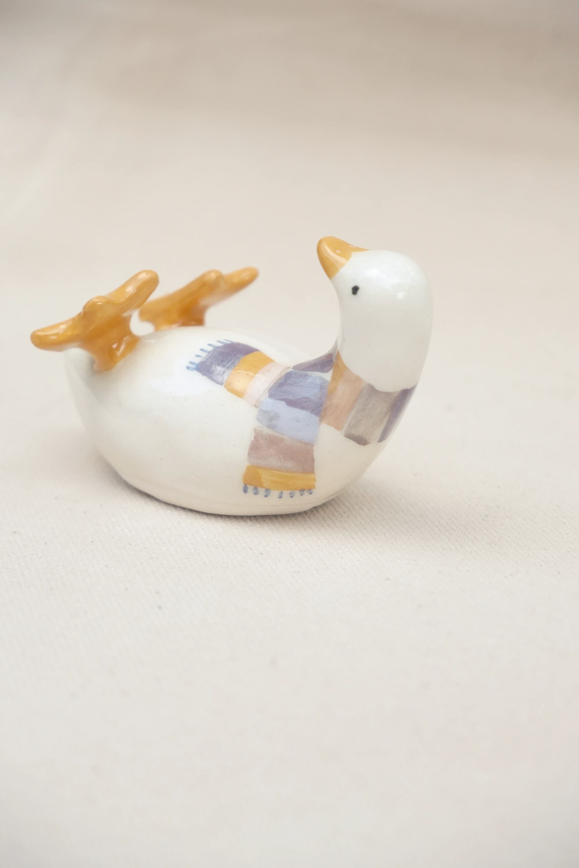 Canard sur le dos écharpe