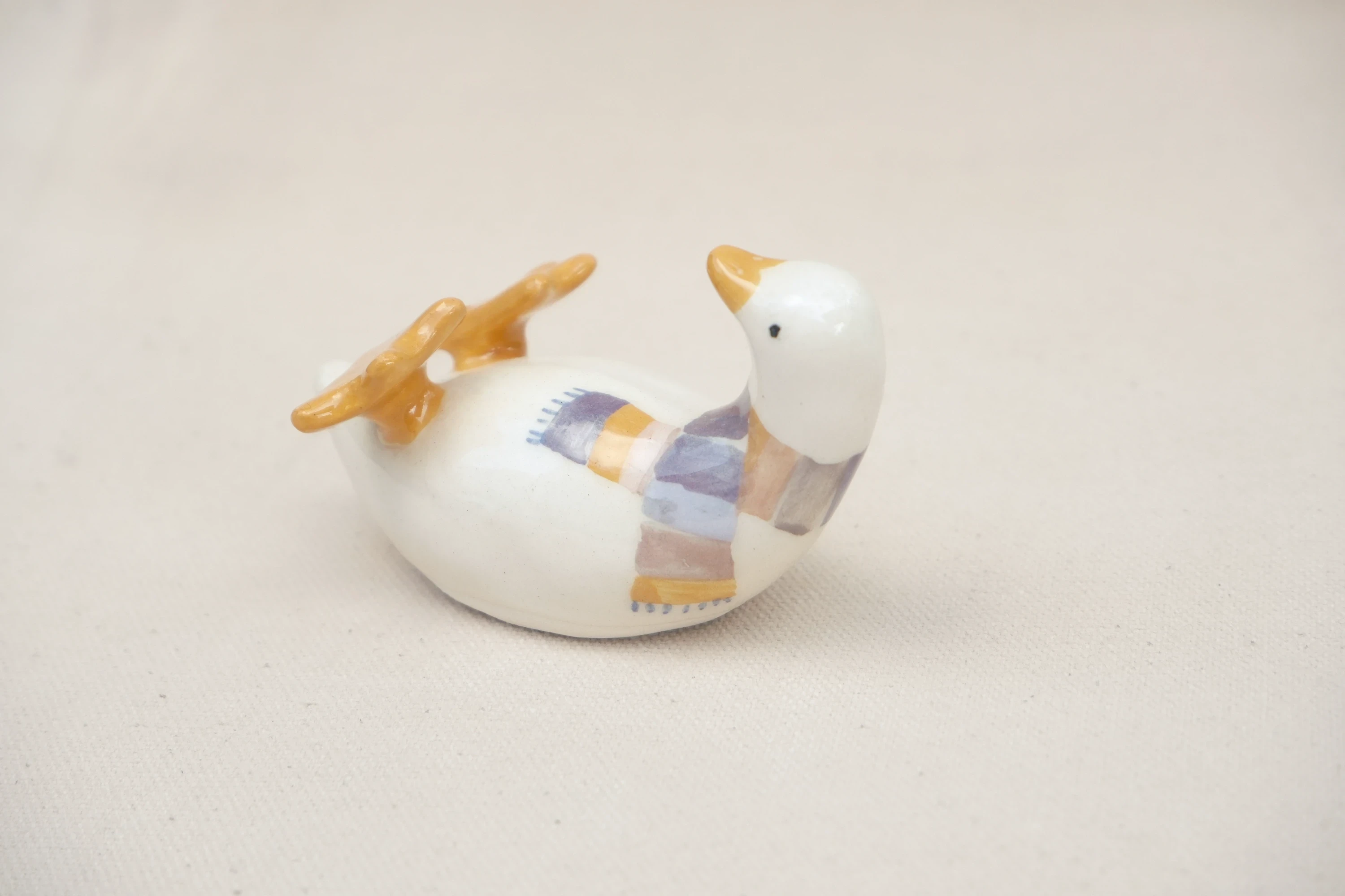 Canard sur le dos écharpe