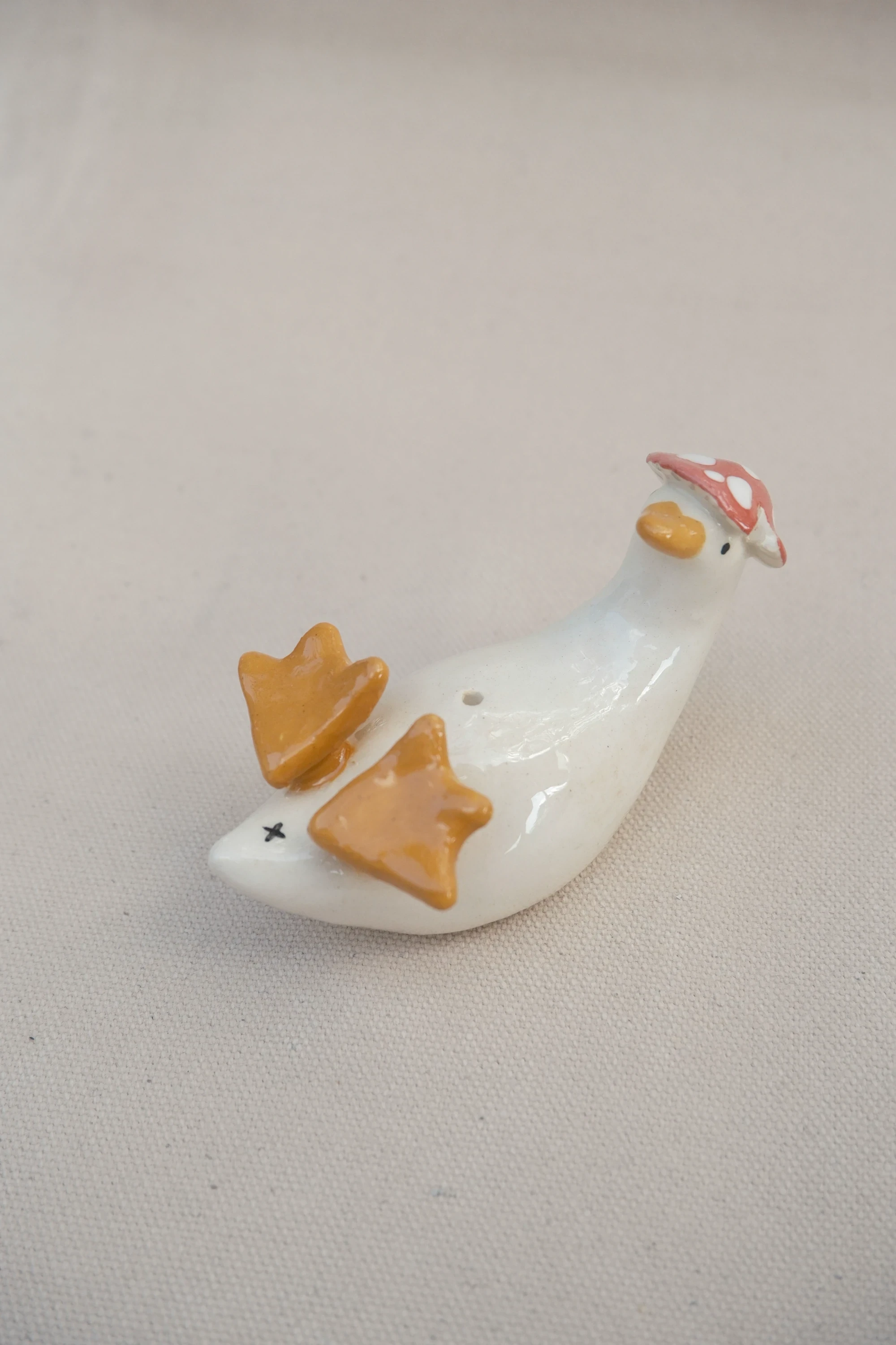 Soliflore canard amanite sur le dos