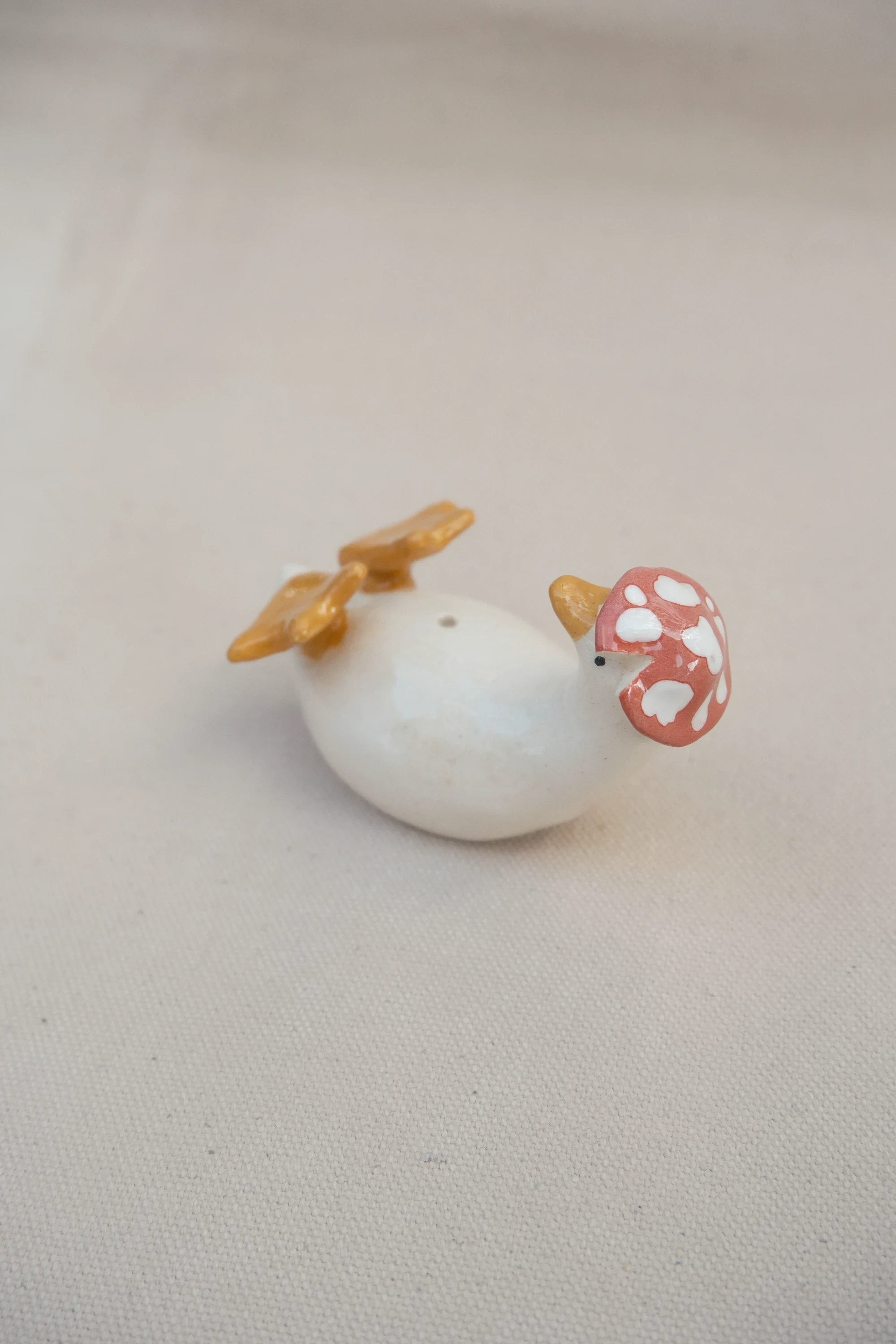 Soliflore canard amanite sur le dos