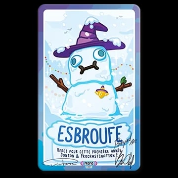 Carte illustrée avec un bonhomme de neige portant un chapeau de sorcier violet. Le texte indique « ESBROUFE », « Merci pour cette première année Donjon & Procrastination » et comporte des signatures.