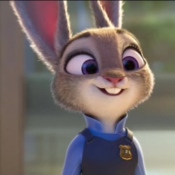 Judie Hoops dans Zootopie, lapin animé souriant portant un uniforme de police bleu avec un badge doré.